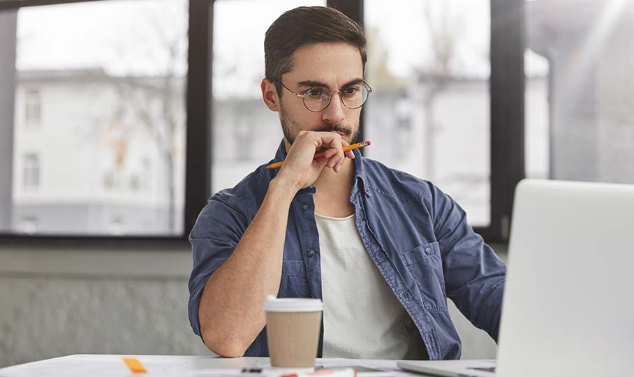 Pensive man with laptop