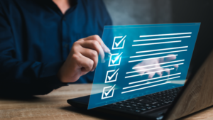 Person using a laptop with a digital checklist representing ABA guidance and requirements.