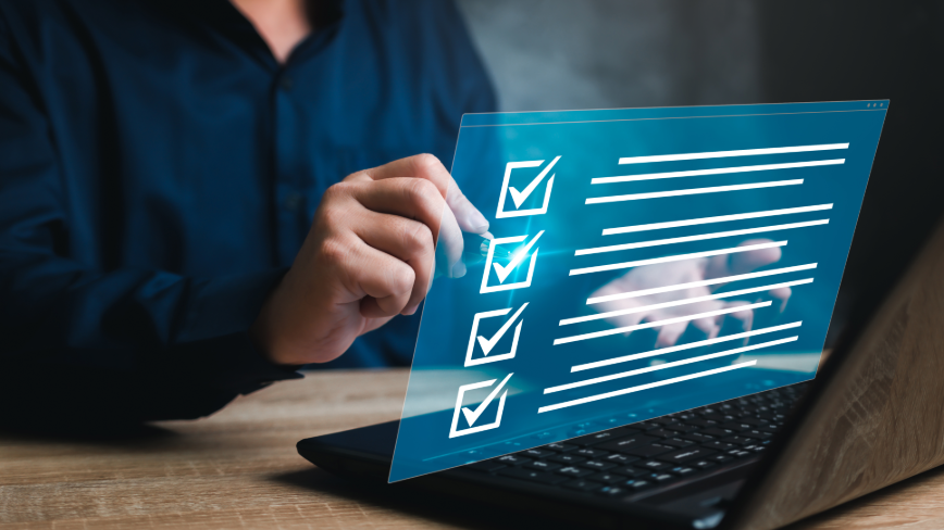 Person using a laptop with a digital checklist representing ABA guidance and requirements.