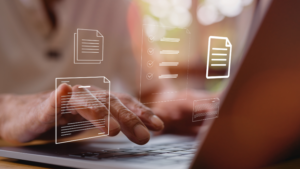 Person using a laptop with digital document and checklist icons representing provider data.